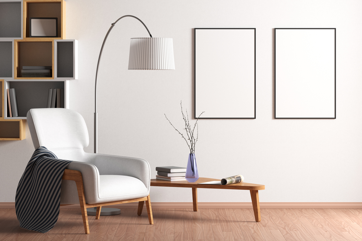 Two blank vertical posters mock up with black frame on the wall in living room interior with bookshelf; armchair; coffee table and floor lamp. 3d illustration